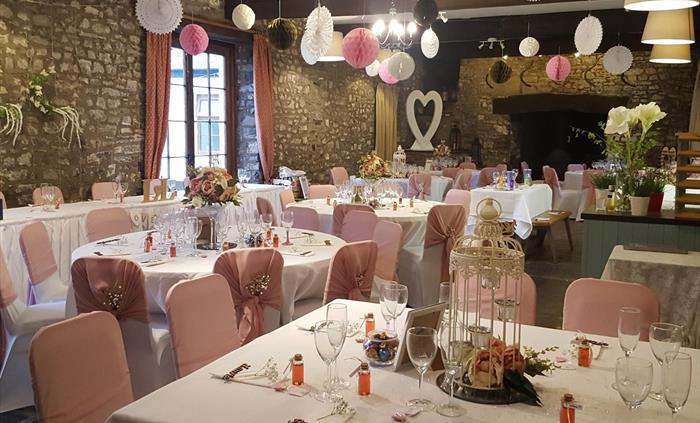 Here the dining room is shown decorated for a wedding in white and pink vintage ornaments. You can arrange the tables and decorate the whole house how